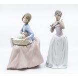 Two Nao figures of young ladies, one with baby