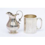 A Victorian silver small pear shaped cream jug, profusely chased with geometric pattern and crest