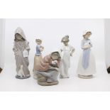 A collection of five Nao figures of young children