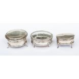 A group of three various silver ring boxes: 1 plain circular, fitted velvet interior on four