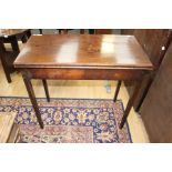 A 19th Century mahogany fold-over tea table, 72cm high, 82cm wide, 41cm deep