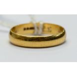 A 22ct gold wedding band, width approx 3mm size M, weight approx 2.6gms