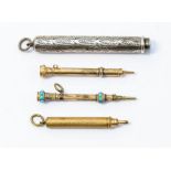 A set of four decorative Victorian retractable pencils to include a silver pencil with engraved leaf