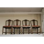 A set of four George III style oak side chairs, traditionally hand crafted, in the manner of