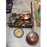 A collection of copper and brass items including kettles, bed pans, pans, horse brasses