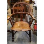 A 20th Century Windsor ash and elm armchair, of traditional design