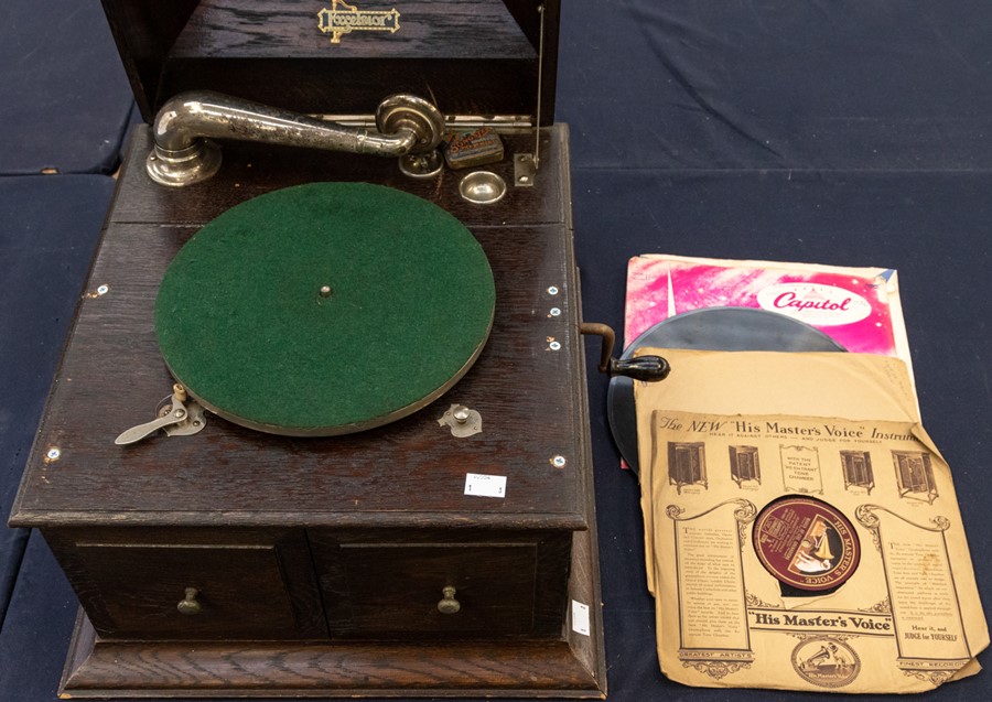 An Excelsior oak cased gramophone, complete with records