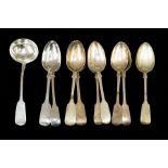 Nine various 19th Century silver fiddle pattern dessert spoons and a sauce ladle, various dates