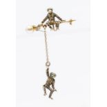 A Victorian silver paste set monkey bar brooch, comprising a seated monkey with another swinging