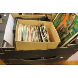 A collection of vinyl records in 3 cases and loose.