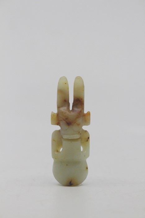 A Chinese pale celadon and russet jade amulet in the neolithic style, Qing Dynasty, of semi- - Image 2 of 3