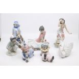 Seven small Lladro figures of boys and girls, clowns, hula girl and swan