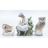 Three Nao figures, girls with bird, owl, baby in chair