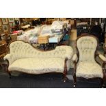 A Victorian rosewood chaise longue, carved rail to top, carved supports, with a matching armchair;