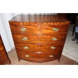 An early 19th Century mahogany bow fronted chest of drawers, fitted with four long graduated