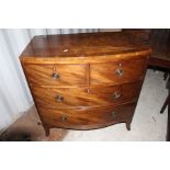 A early 19th Century mahogany chest of drawers, bow fronted, comprising two short over two long