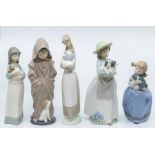 Five Nao figures of young children with animals