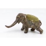 An early 20th Century German metal pin cushion cast as an Elephant, stamped GERMANY underside,