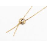 A diamond and 9ct gold necklace, comprising a double crescent pendant set with a small brilliant cut