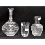 A mid Victorian wheel etched shaft and globe decanter, no stopper, a water with a waisted neck and a