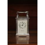 Two carriage clocks, comprising a Mappin & Webb silver plated carriage clock, white dial and black