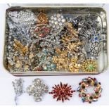 A collection of vintage paste set jewellery to include various brooches, clip on drop earrings and