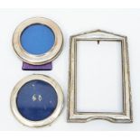 A collection of three various silver frames, 2 round and 1 rectangular, various dates and makers (3)