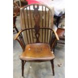 A 19th Century ash and elm Windsor armchair, spindle back, spindle missing