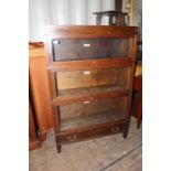 An early 20th Century Globe Wernicke Universal oak stacking bookcase, of three sections, with a