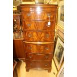 A Georgian style mahogany chest on chest, made as one piece, the upper section with three drawers,