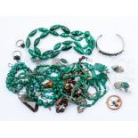 A collection of malachite jewellery comprising bead necklaces, rings and earrings some with clip