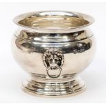 A Modern silver plain ogee shaped two handled bowl, ring handles with lion's head terminals, by