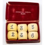 A set of six late Victorian ivory napkin rings, with silver numbers from 1 to 6