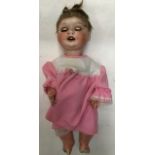 Heubach Bisque Head Doll With open mouth showing four teeth. Missing some eye lashes. No cracks.