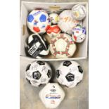 A collection of assorted footballs to include: France 98 World Cup; Derby County; a signed football,