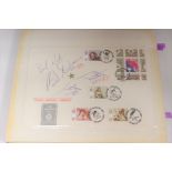 Olympic Memorabilia: An album containing an extensive collection of autographs upon First Day