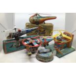 Tinplate: A collection of assorted vintage tinplate helicopters including Police Helicopter (Japan),