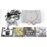 PlayStation: A boxed PlayStation 1 console, complete, together with four cased games: Driver,