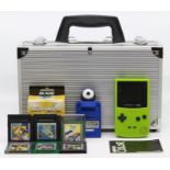 Gameboy: A lime green, Game Boy Color, scratches to screen, and general wear to case, with