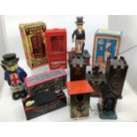 Money Boxes: A collection of vintage money boxes including: Yone Japan tinplate clockwork Coffin