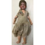 Armand Marseille: A German Armand Marseille doll along with a mid 20th century hard plastic doll