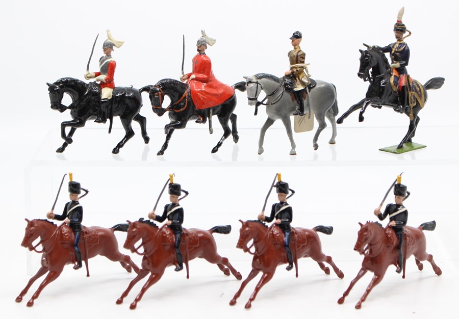 Britains: A collection of eight various horseback military figures, unboxed.