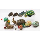 Tinplate: A collection of eleven various tinplate, clockwork animals to include: two Schuco mice,