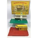 Matchbox: An unboxed Matchbox Lesney Garage, together with a boxed MG1 service station (boxed),