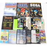 Sega: A collection of assorted Sega manuals, books and videos to include: The Essential Guide to