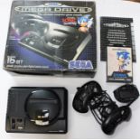 Sega: A boxed Sega Mega Drive console, complete with original box, two controllers, cased Sonic