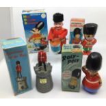 Tinplate: A collection of tinplate and plastic Guards including Marx clockwork Mad Russian