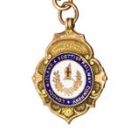 Railwayana Interest: A 9ct gold and enamel 'London Midland and Scottish Railway Company' medal,