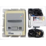 Nintendo: A boxed Super Nintendo Entertainment System, complete, with Street Fighter II cartridge