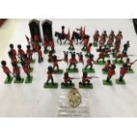 Britains: A collection of assorted Britains Guards, assorted  plastic and metal. Two sentry boxes.